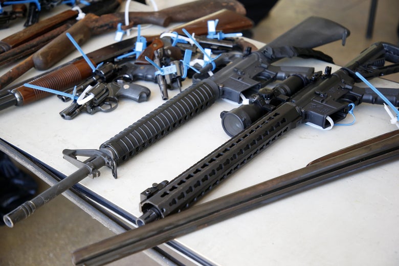 Two AR-15 rifles, along with other assorted guns